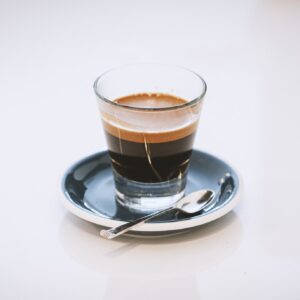 Espresso being pulled from a machine