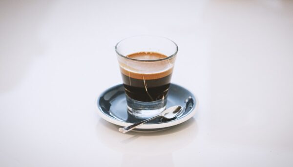 Espresso being pulled from a machine